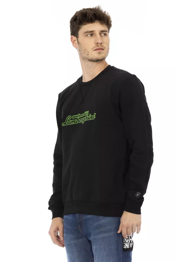 Man wearing black sweatshirt with green lettering