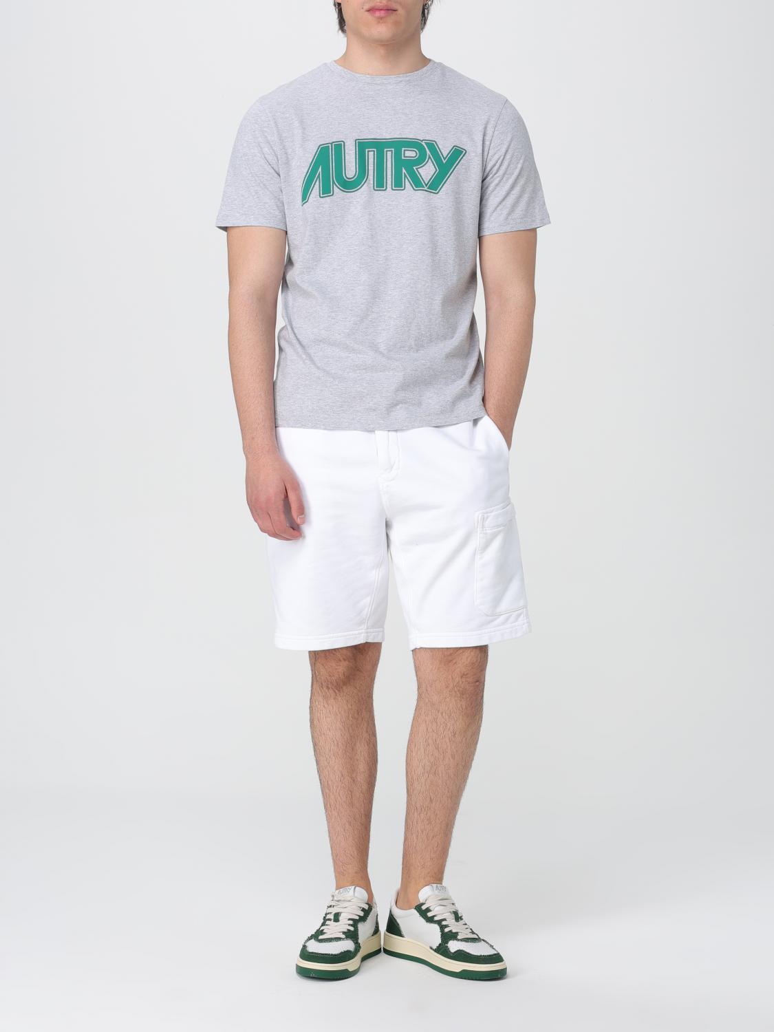 A gray cotton t-shirt with green lettering on front