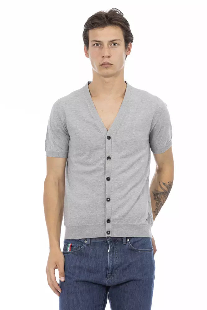 Mannequin wearing gray cardigan over denim shirt and jeans