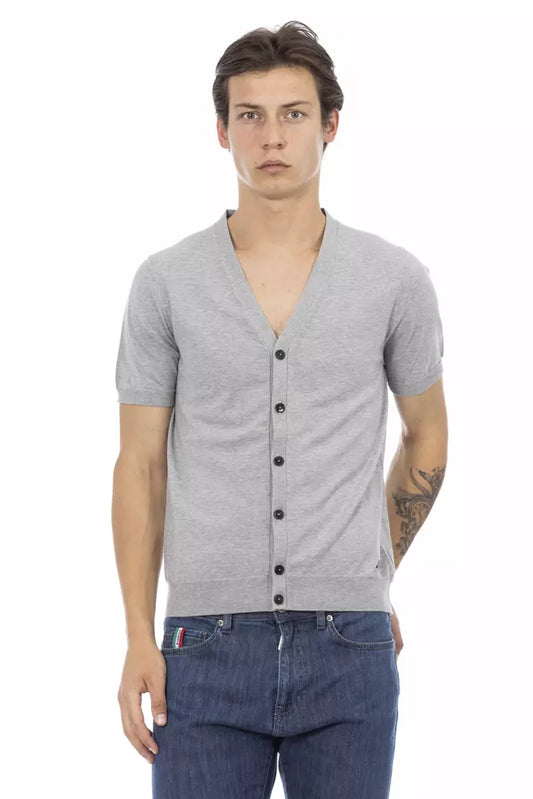 Mannequin wearing gray cardigan over denim shirt and jeans