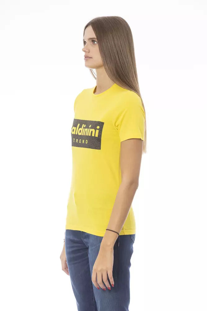 Yellow t-shirt with black lettering on a woman's torso