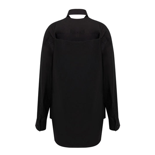 A long black cotton dress with a high neckline and long sleeves