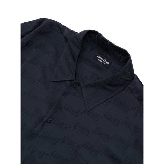 A gray viscose dress shirt with a patterned design on the front, featuring a collar and button-up closure