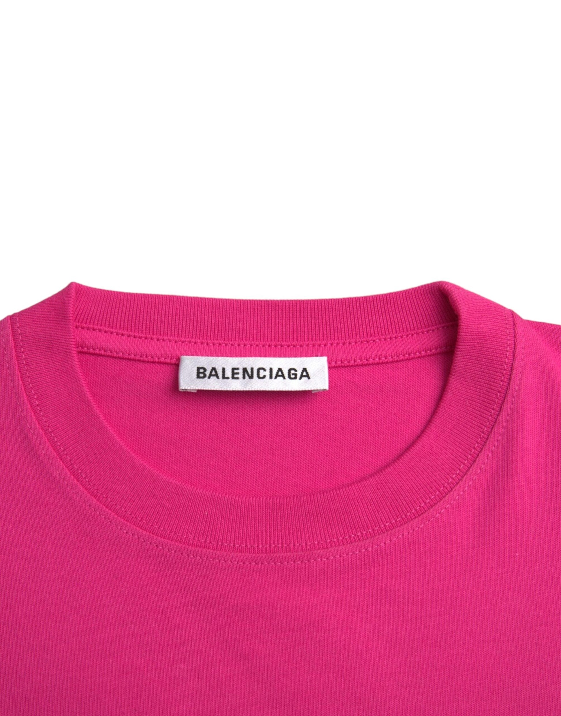 Pink sweater on hanger
