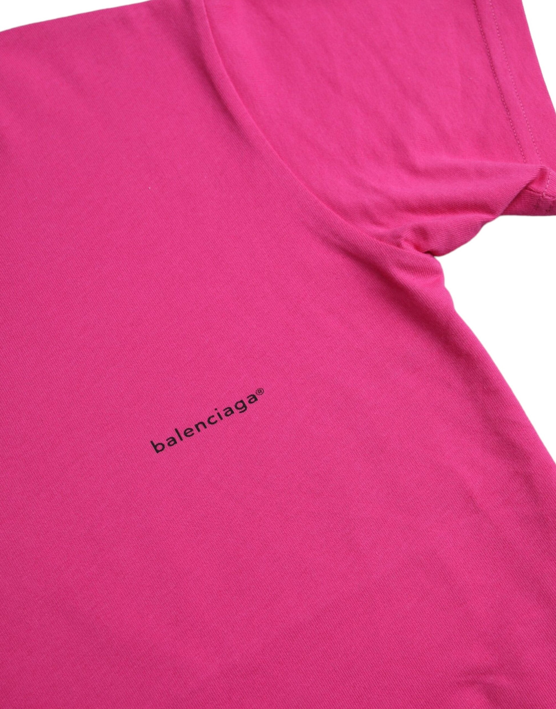 Pink t-shirt with black logo on front