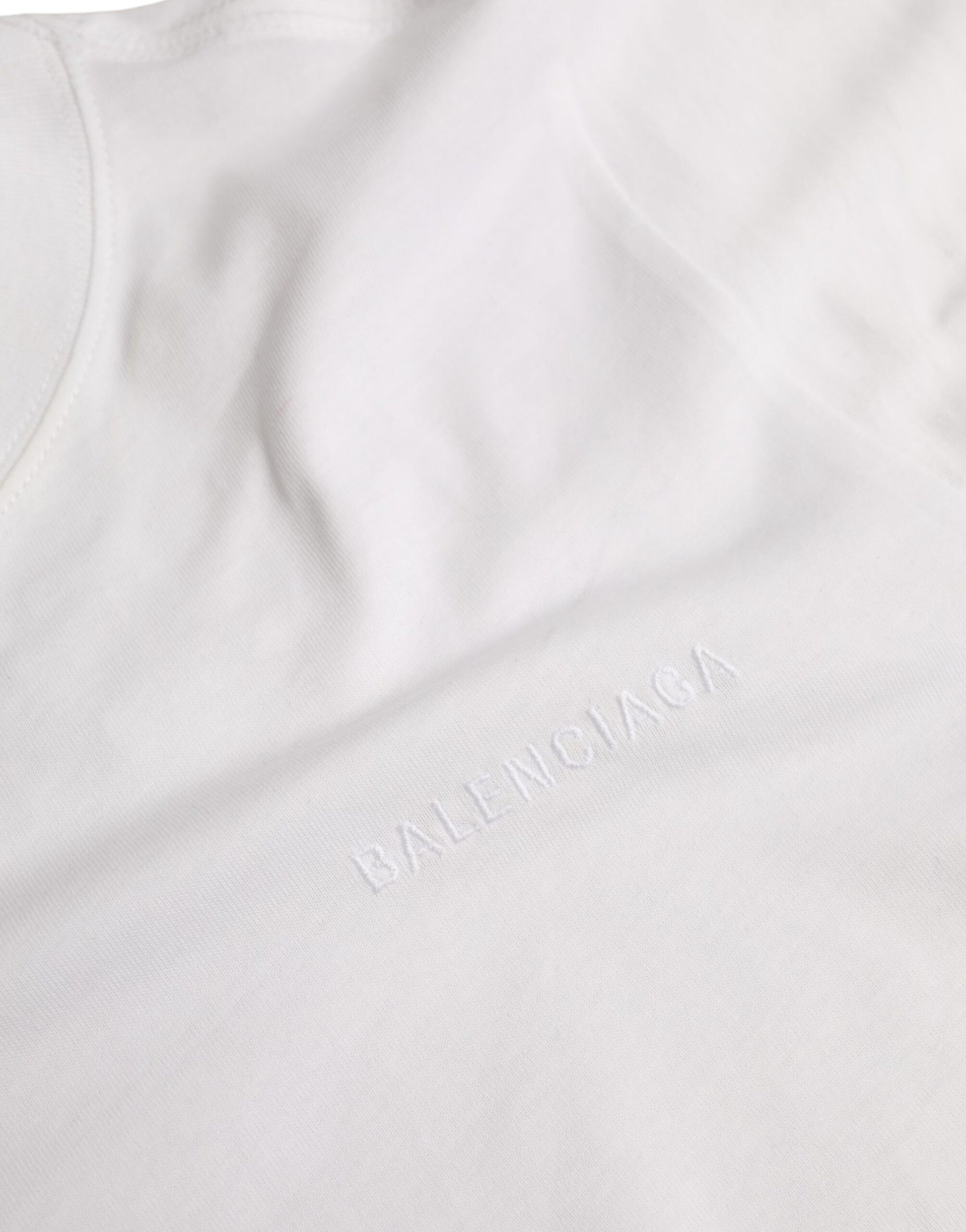 A white cotton crew neck t-shirt with a logo on the left chest area