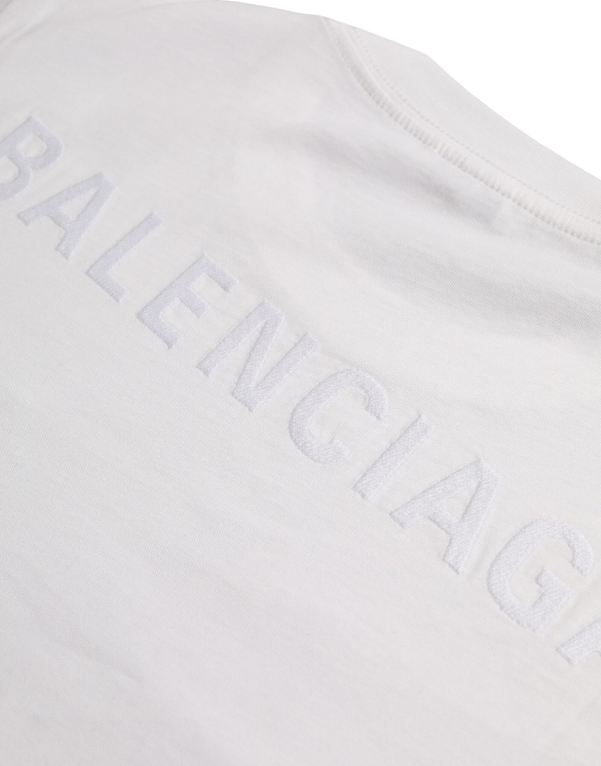A white cotton crew neck short sleeve t-shirt with the word "Balenciaga" printed on it