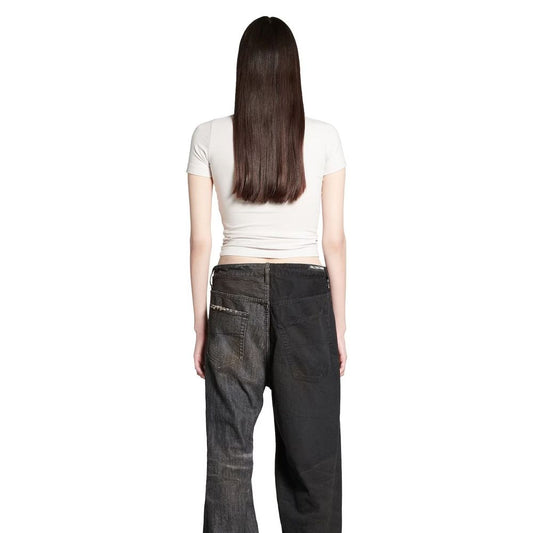 Woman wearing long pants and white top