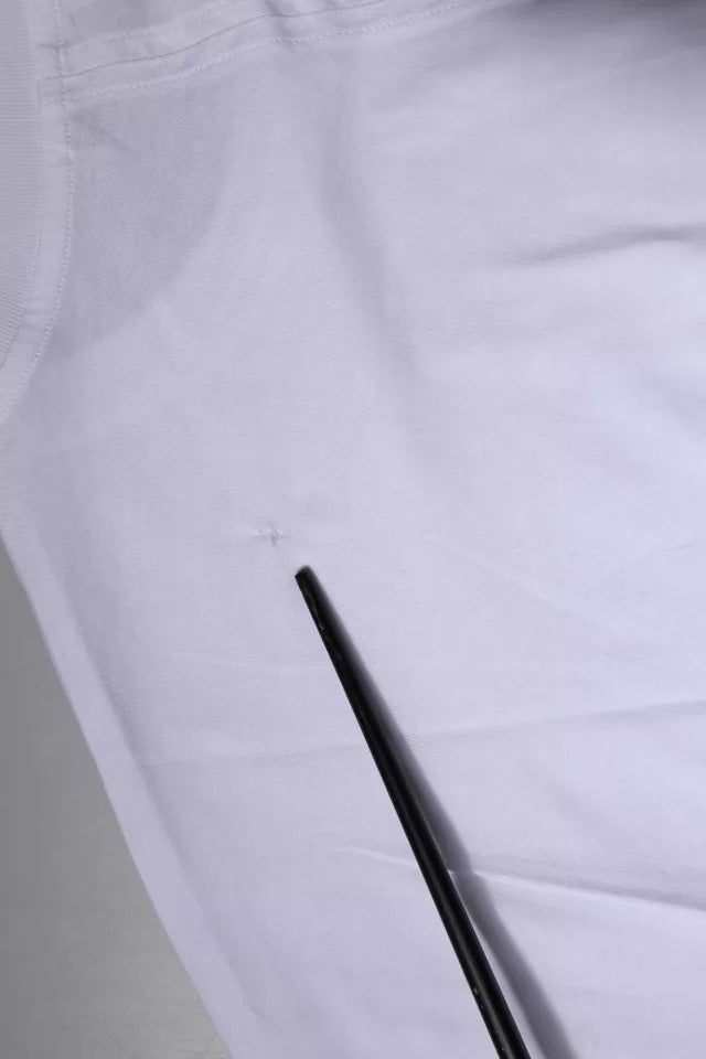 White pants with black stripe down side seam