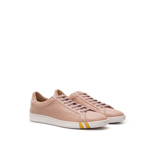Pink sneakers with white laces and yellow stripe on side