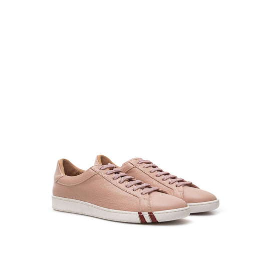 Pair of pink leather low top sneakers with white laces and red stripe on side