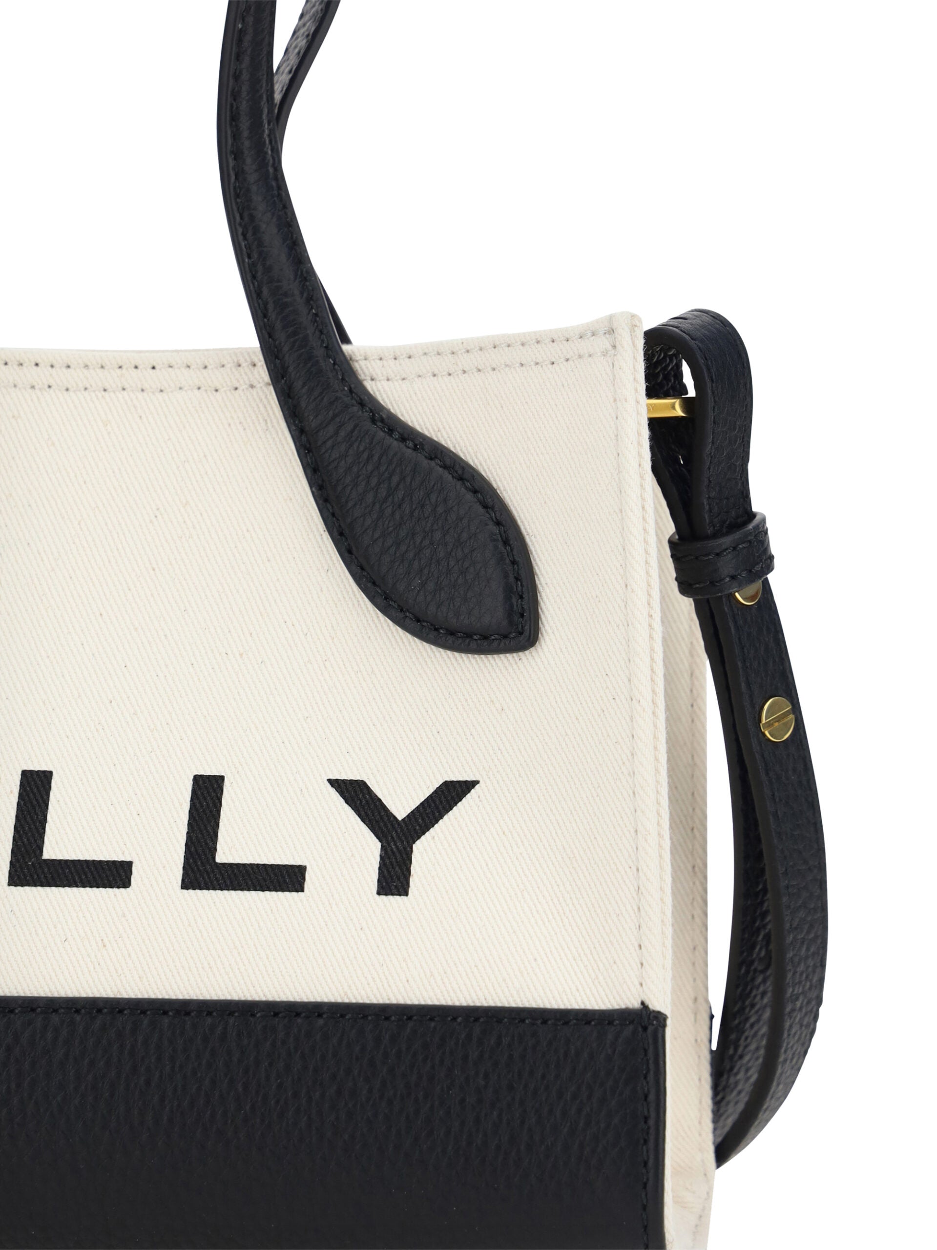 Black and white tote bag with leather straps