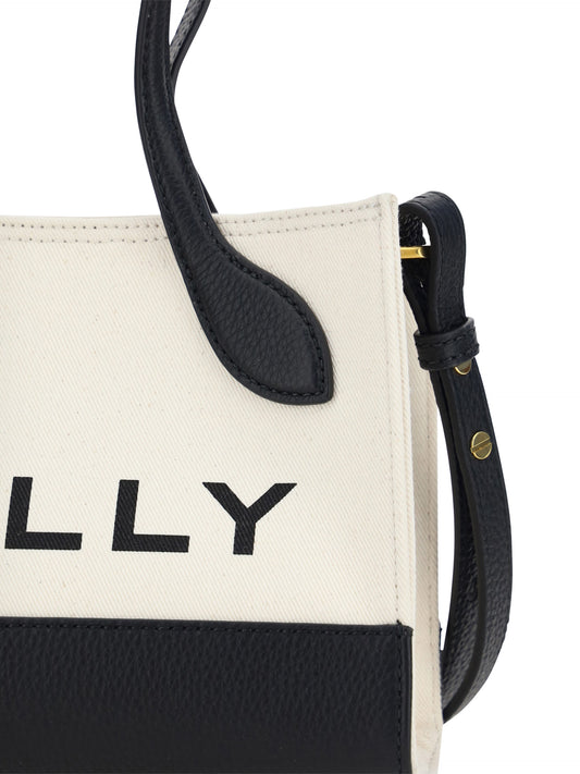 Black and white tote bag with leather straps