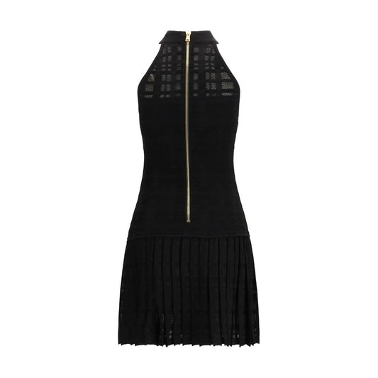 A black cocktail dress with a zipper in front, made of viscose fabric