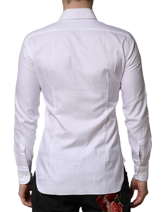 A white long sleeve collared dress shirt with a formal design