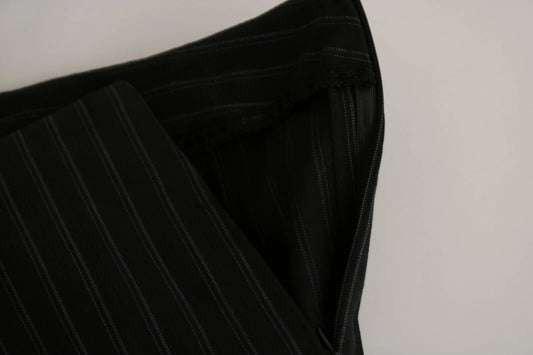 A pair of black high waist straight dress trousers with a visible zipper
