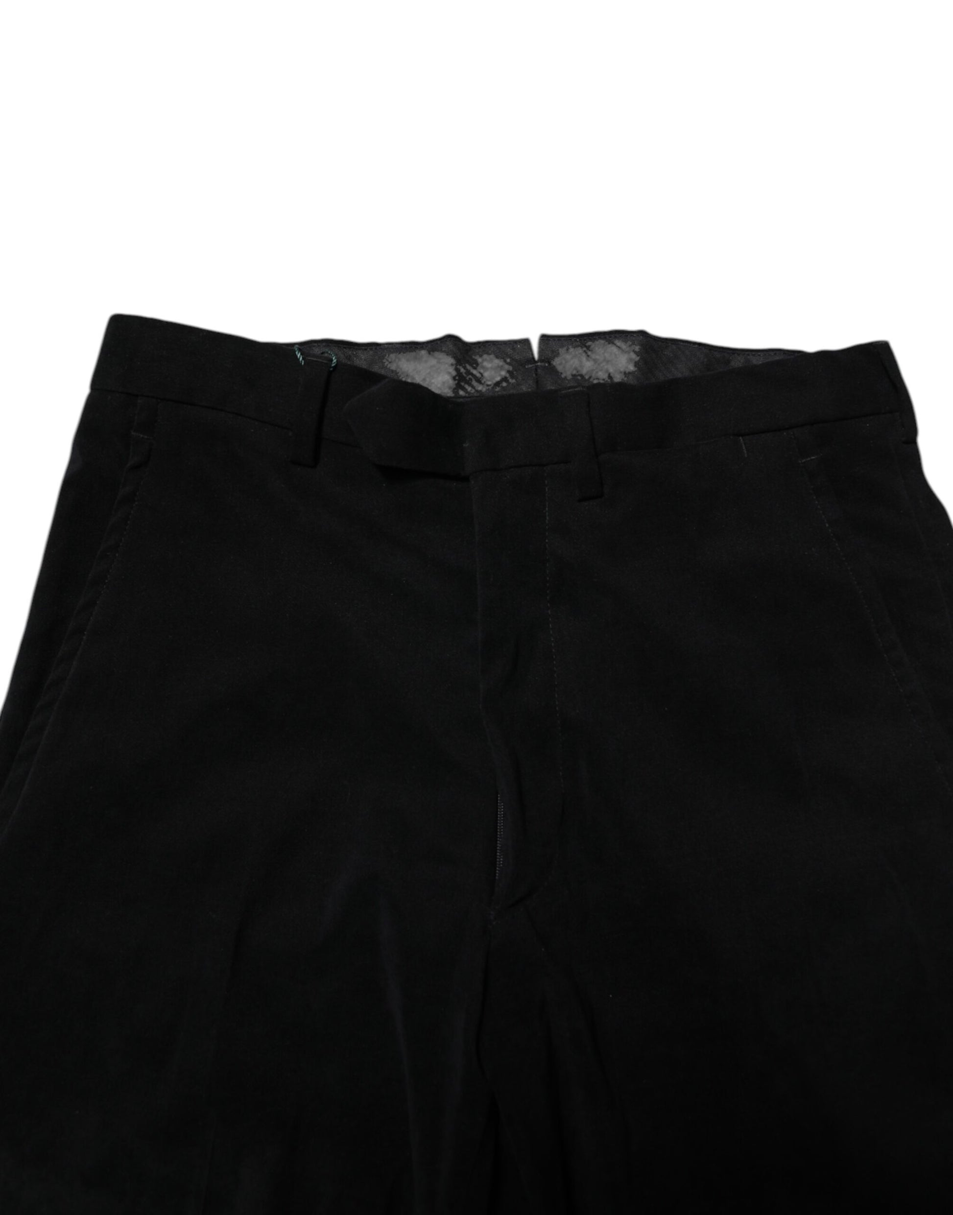 A pair of black mid waist dress pants with a textured pattern and a zipper fly