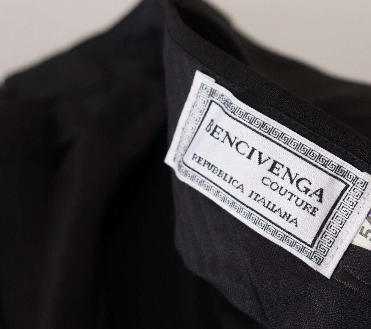 Black jacket with white label on sleeve