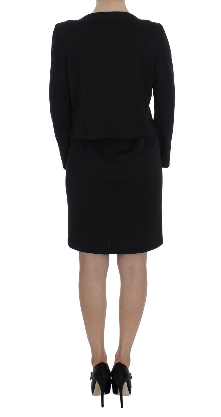 A black dress with a sweater set, featuring a sheath design and stretch material