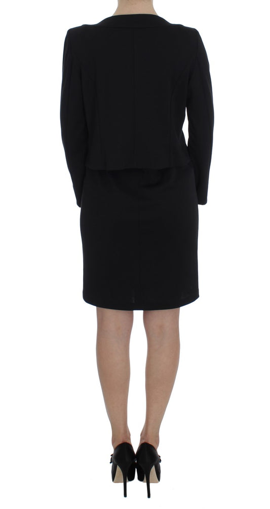 A black dress with a sweater set, featuring a sheath design and stretch material