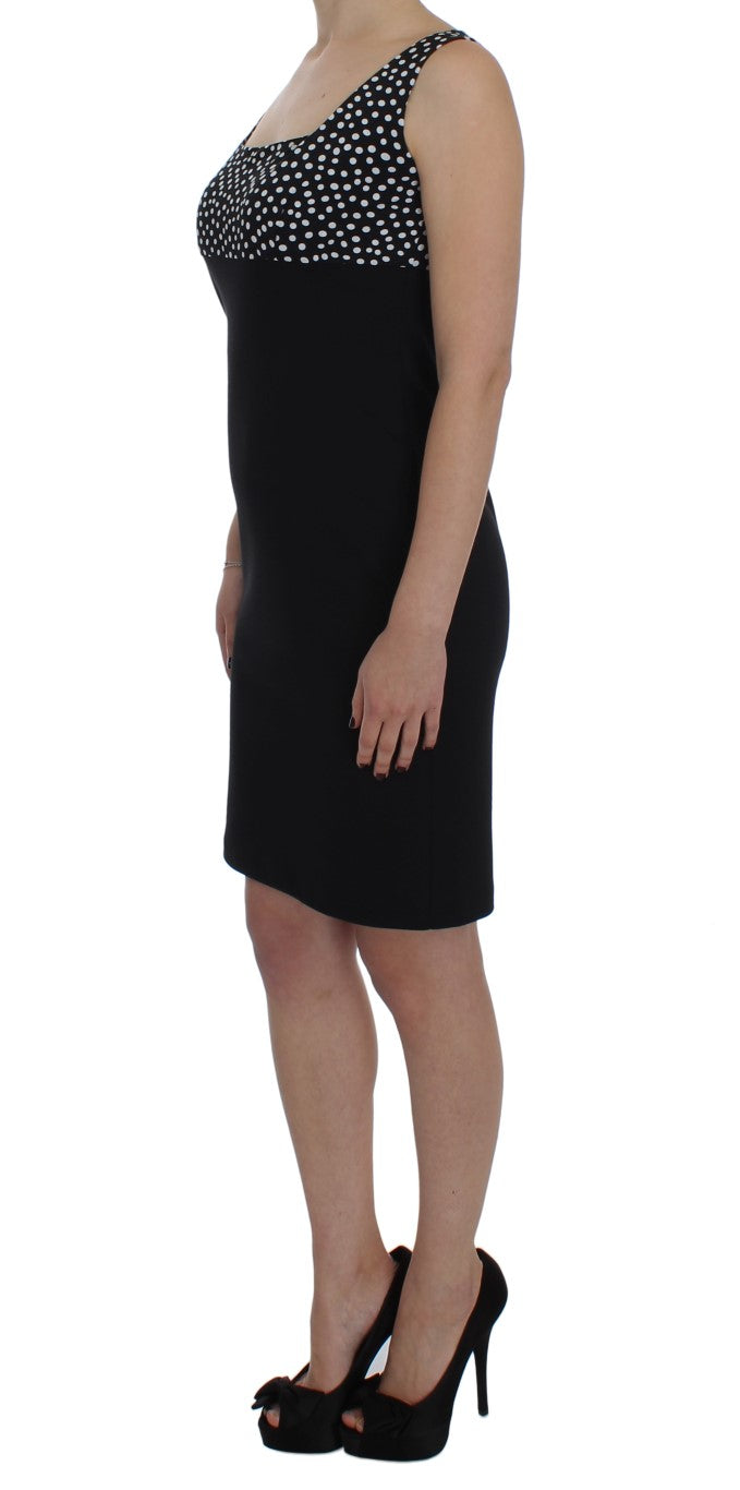 A black dress with a sheer top and a sweater set