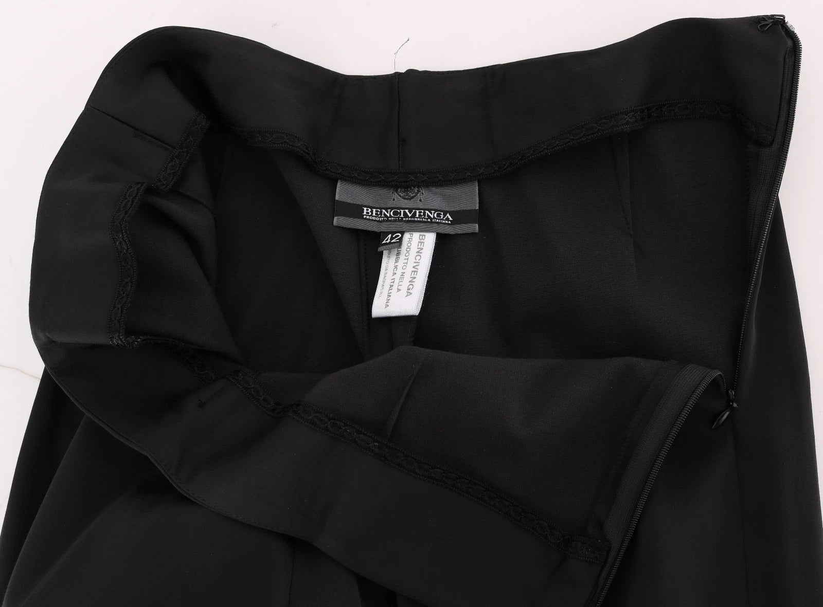 Black jacket on hanger with label