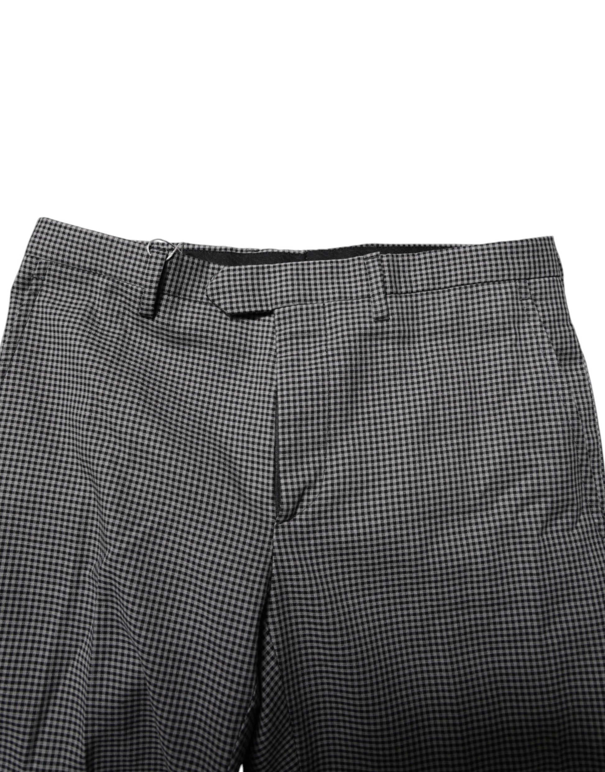 A pair of black and white checkered tapered dress pants