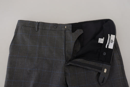 Men's gray checkered wool dress pants with black buttons and a label on the waistband