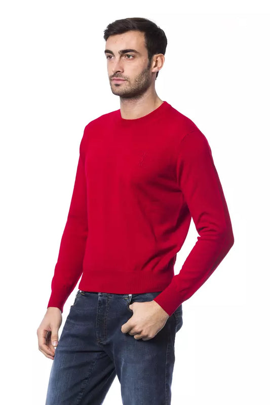 Man wearing red sweater and blue jeans