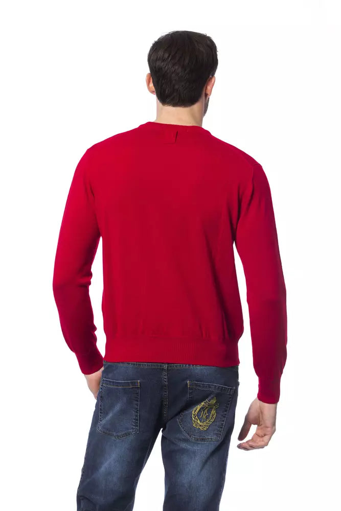 Man wearing red sweater and blue jeans