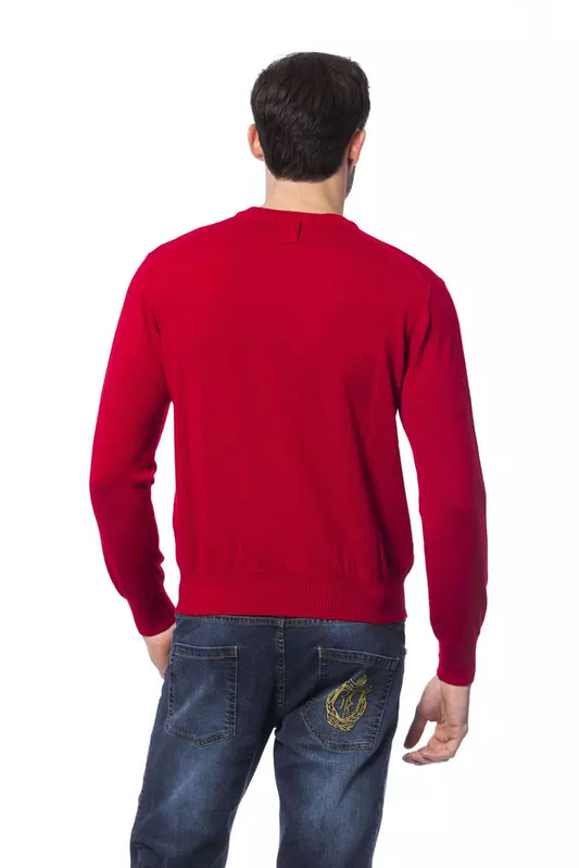 Man wearing red sweater and blue jeans