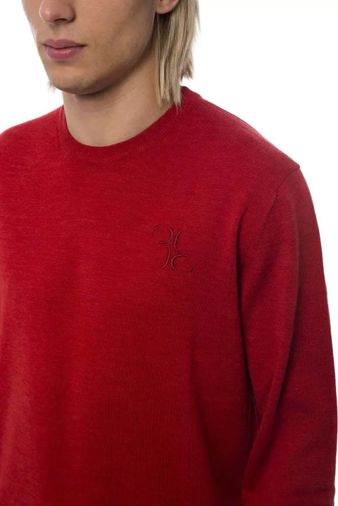 Man wearing red sweater with logo on left chest