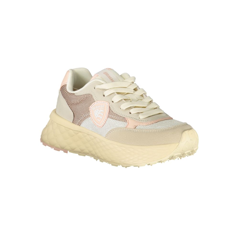 A beige women's sneaker with a textured sole, lace-up front and pink accents