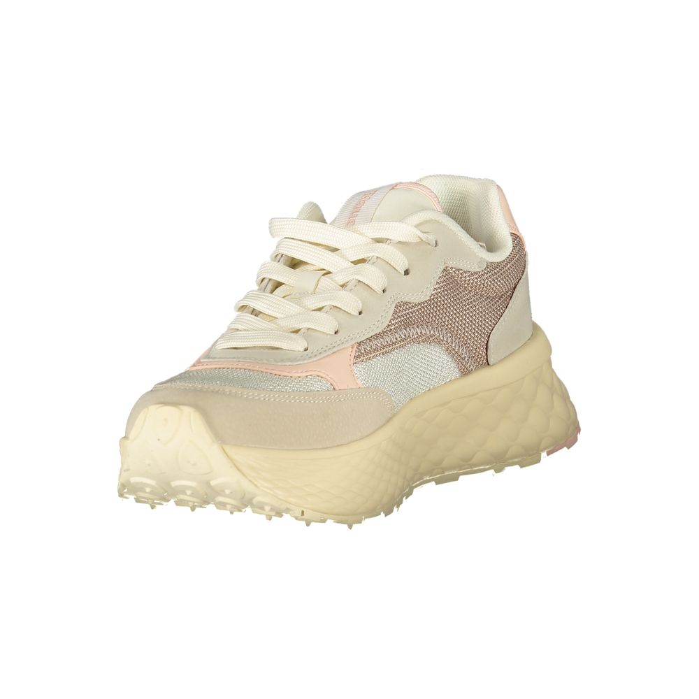 A beige women's sneaker with a textured sole, lace-up front and a small heel