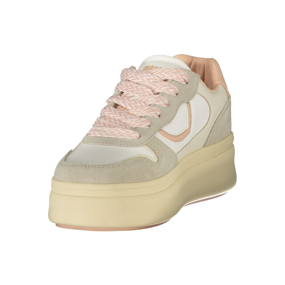 A women's sneaker with a pink lace, tan base, and white accents