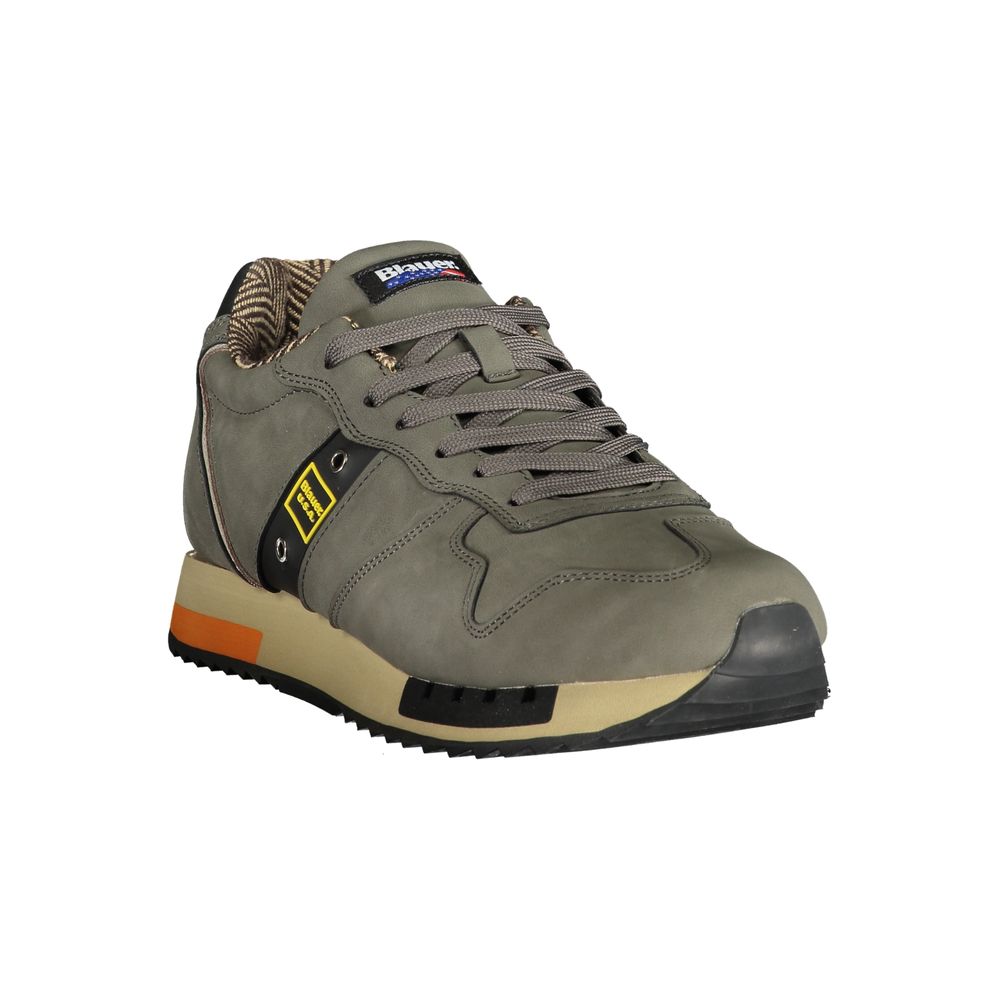 A gray men's sneaker with yellow accents, laces, and a rubber sole