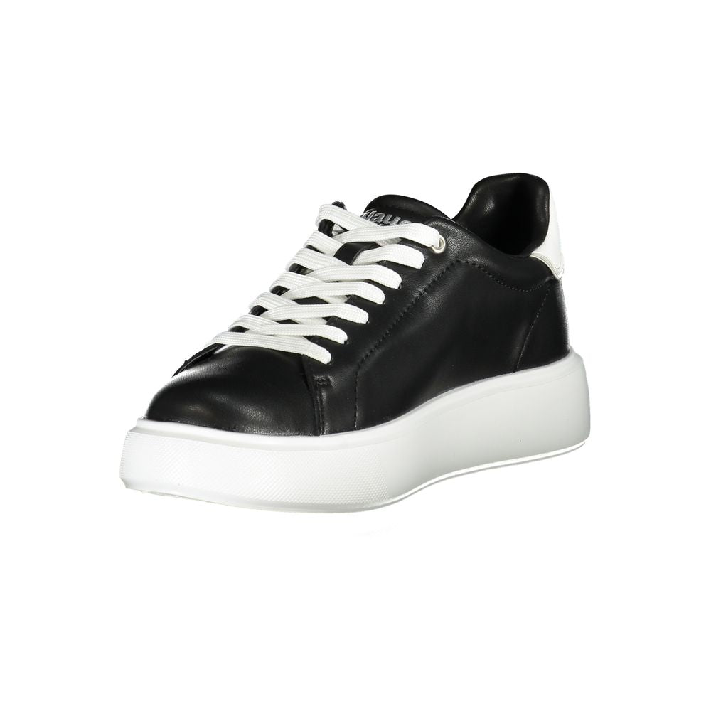 Black and white women's sneaker with laces, flat sole, and side stripe detail