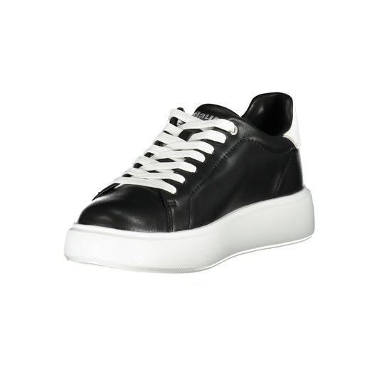 Black and white women's sneaker with laces, flat sole, and side stripe detail