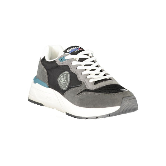 A black and white sneaker with a teal stripe on the side, featuring a circular logo on the tongue