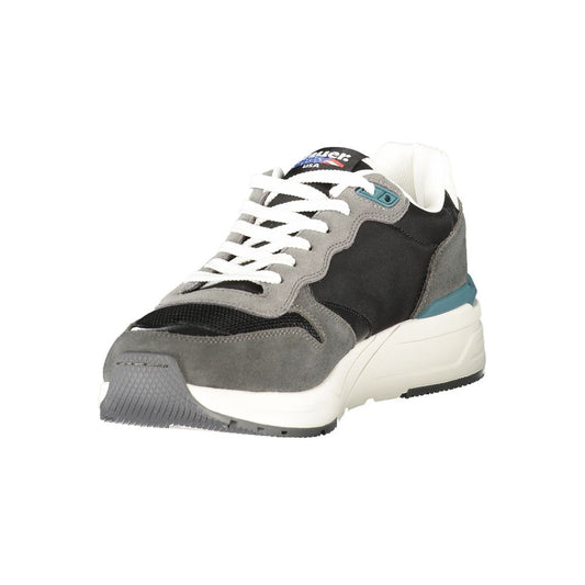 A single black and white sneaker with a gray sole, laces, and heel tab