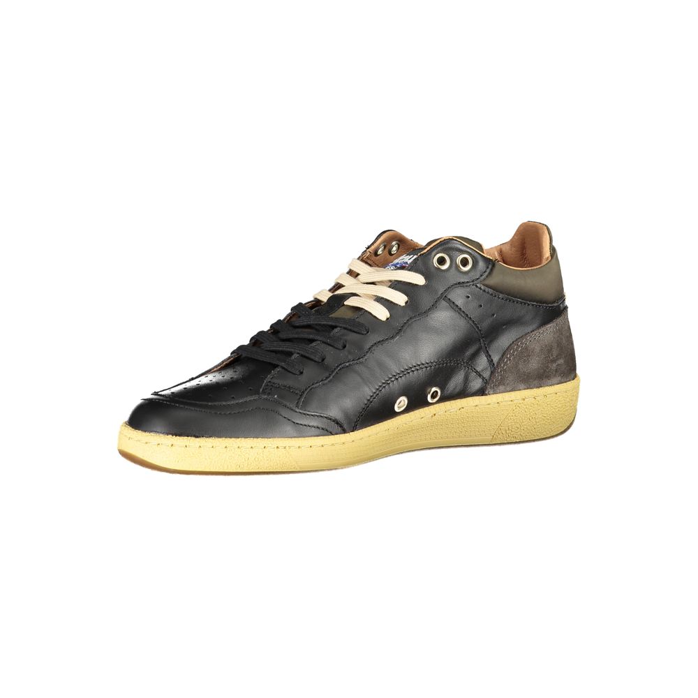 A pair of black lace-up sneakers with contrast details and a yellow sole
