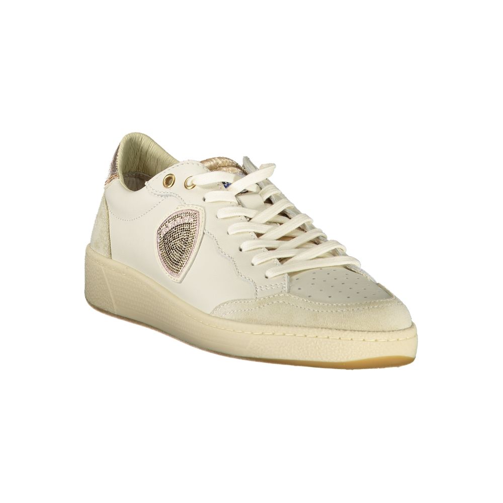A white leather women's sneaker with a gold buckle, featuring a pink logo on the side and a tan sole