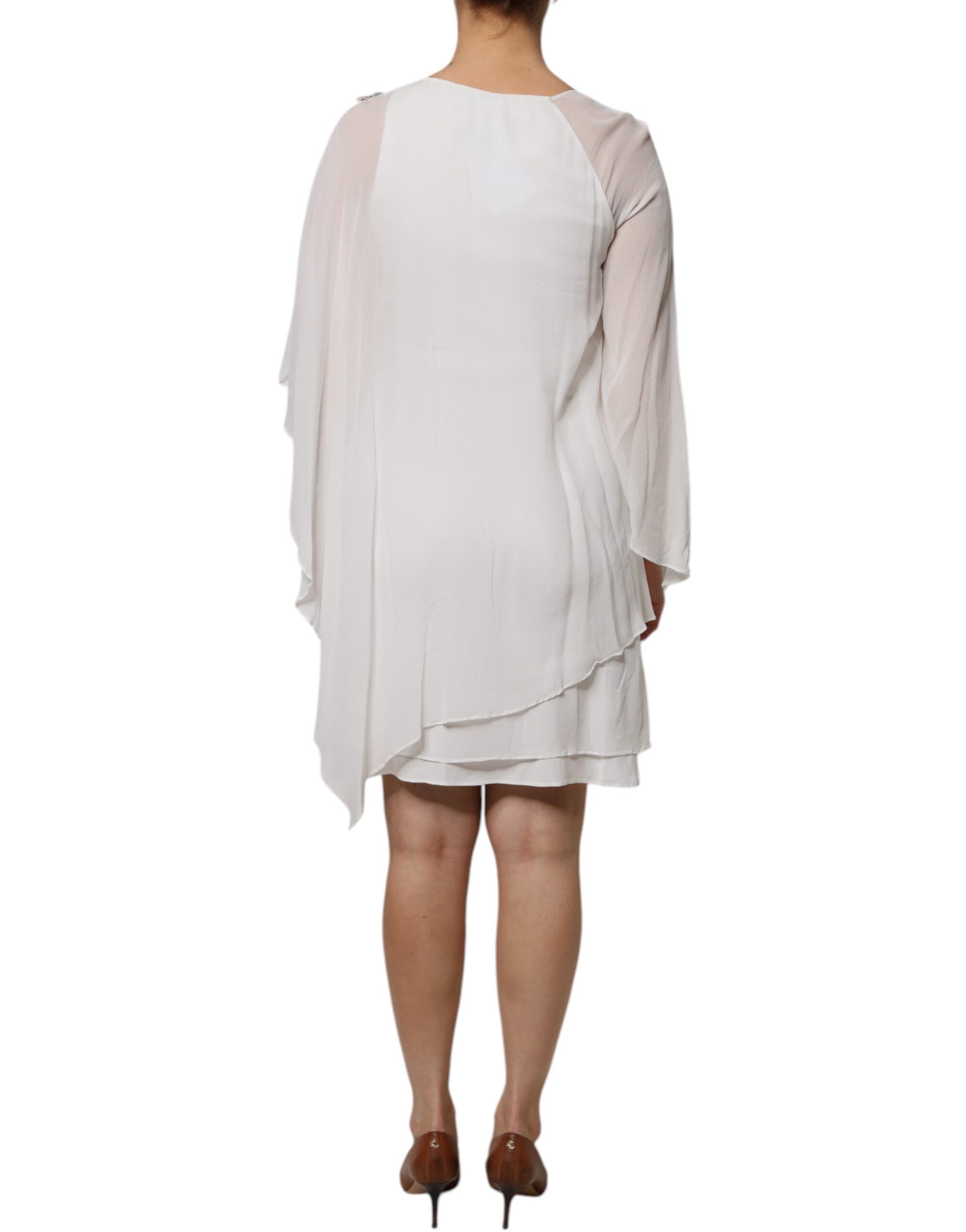 A white chiffon dress with floral embroidery and a shift silhouette