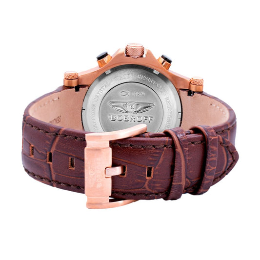 A brown leather watch with a copper buckle and a silver face featuring the Bentley logo