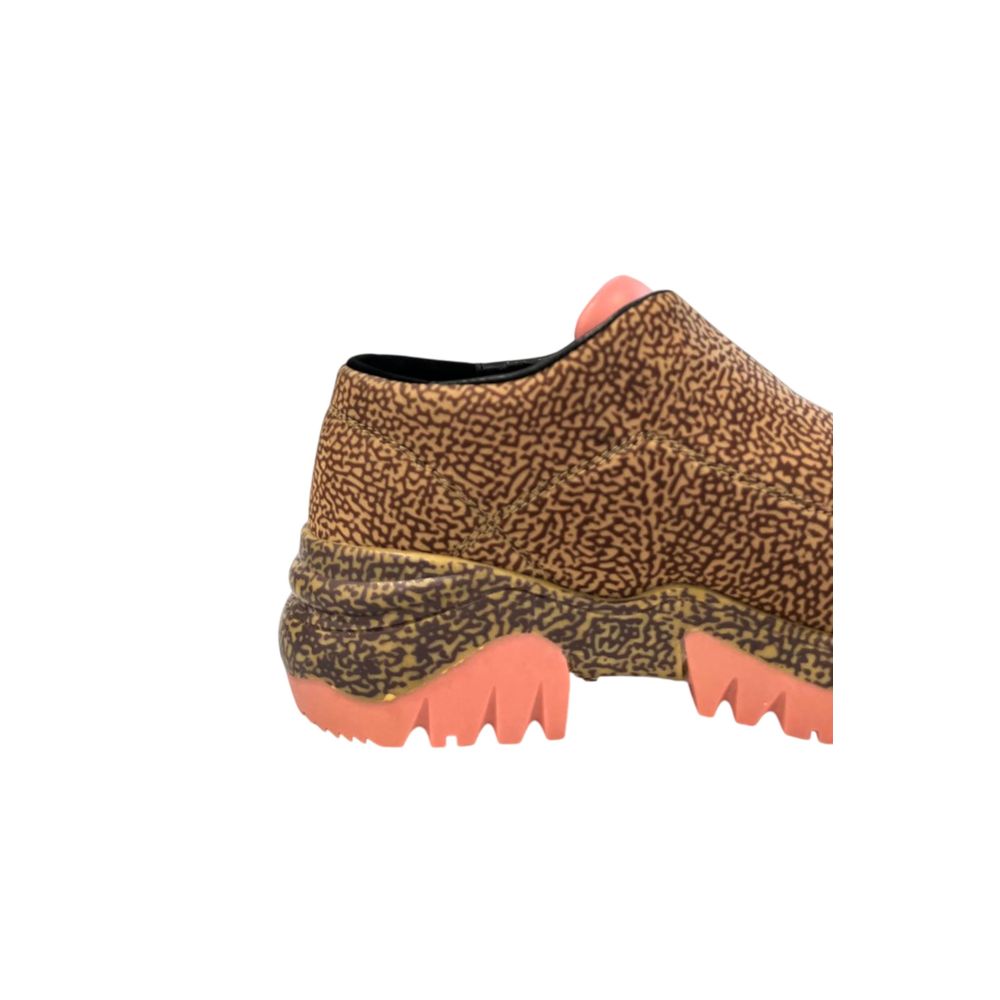 A beige leather women's sneaker with a floral pattern and red accents