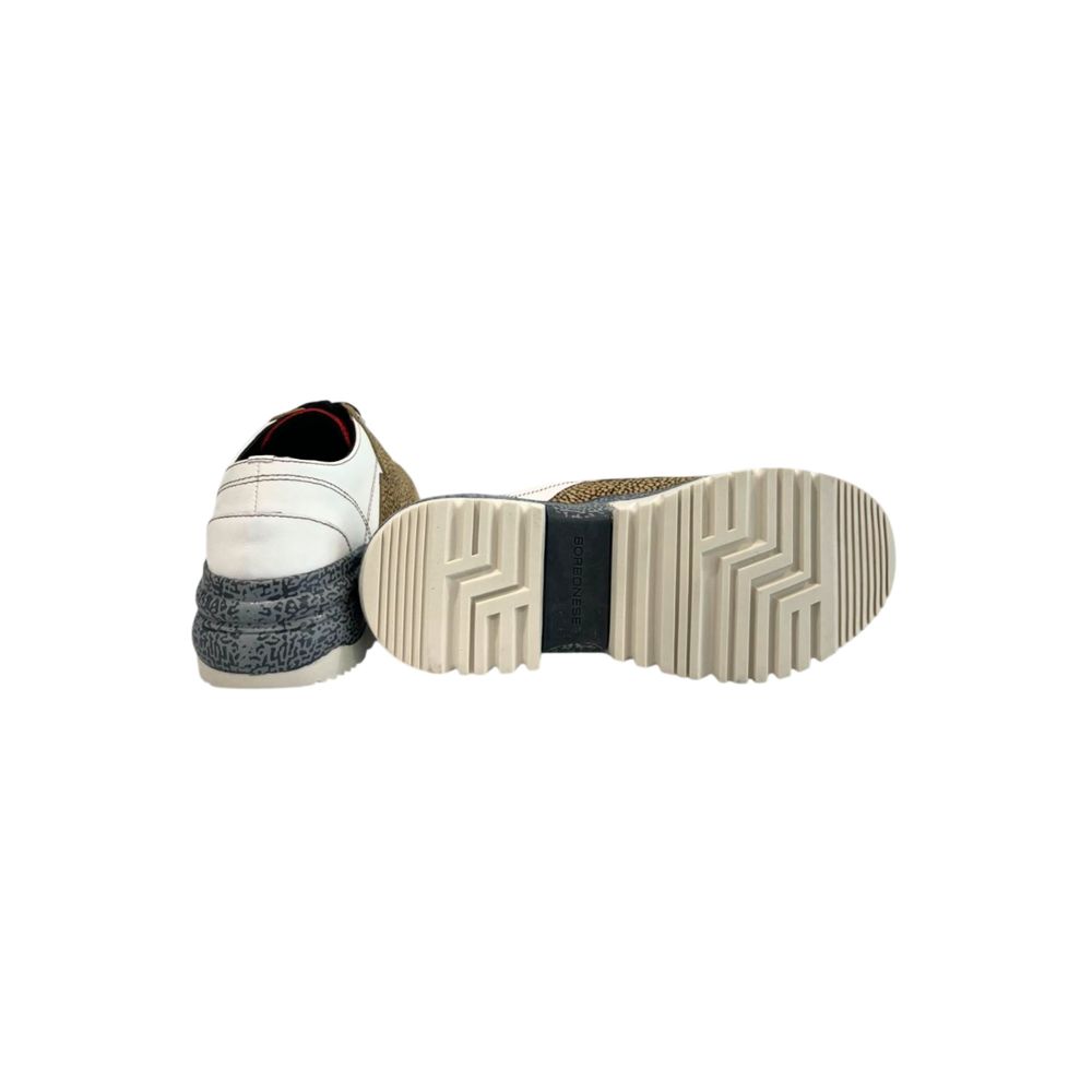 A pair of women's sneakers with a beige leather upper, featuring a lace-up closure and a flat sole
