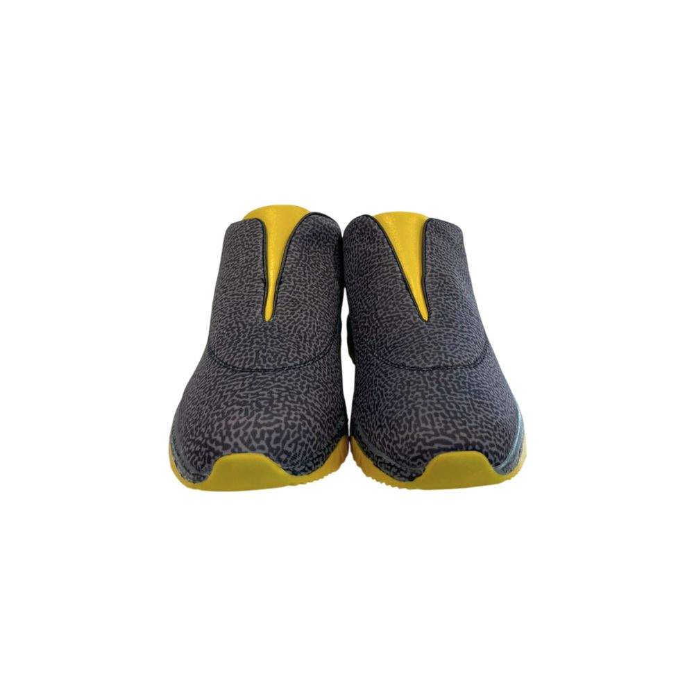 Pair of black leather women's sneakers with yellow accents