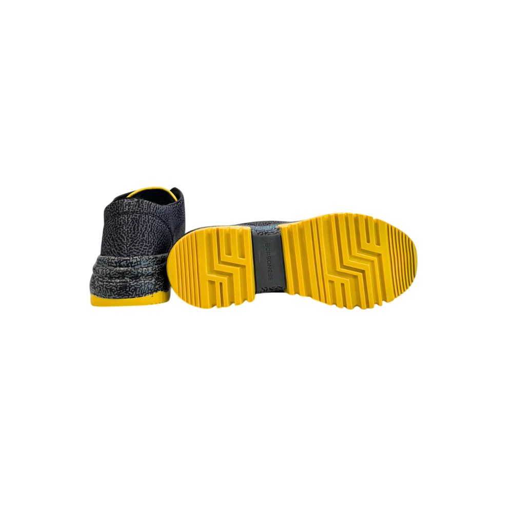 A black leather women's sneaker with yellow sole