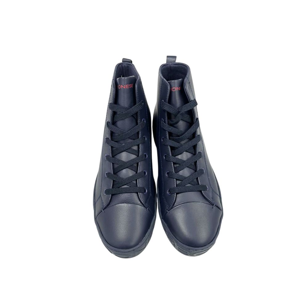 Pair of black leather sneakers with white laces, branded logo on side and tongue