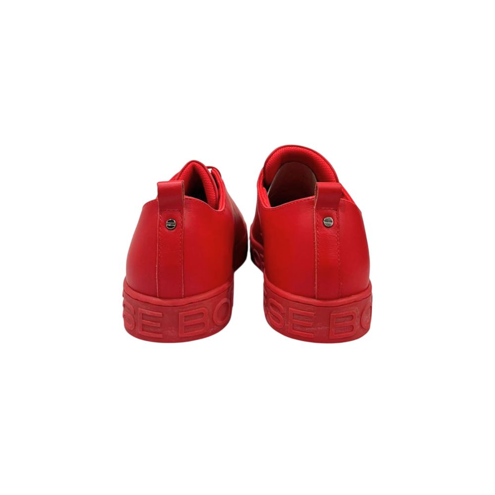 Pair of red leather men's sneakers with white laces and logo on side